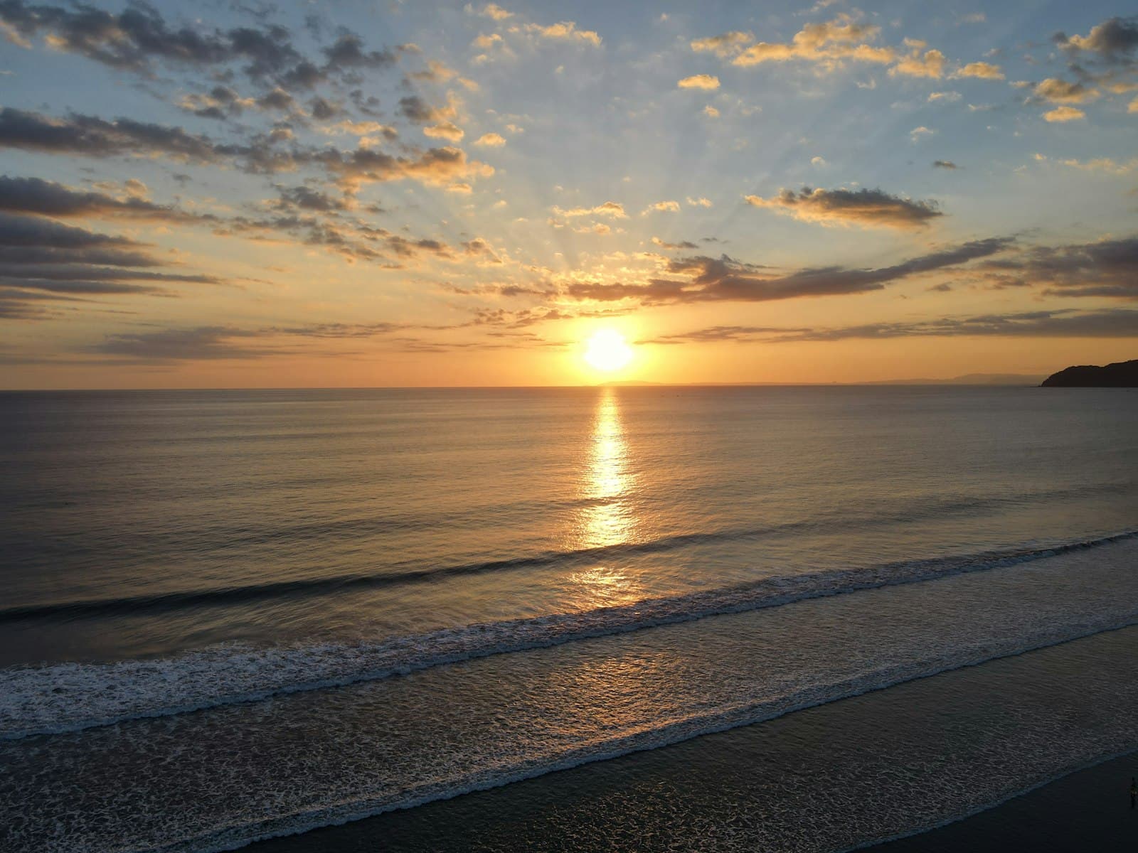 Sunset over the surf at Jaco Beach