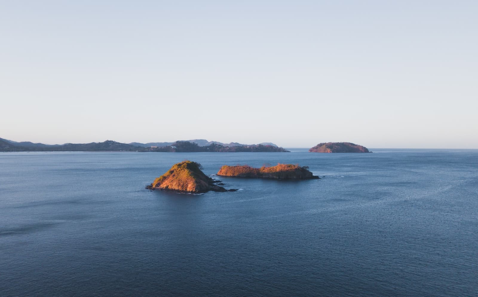 Rocky islets in calm Guanacaste gulf water near the Gulf of Papagayo